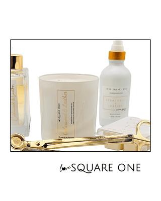 Cedarwood & Leather Room Spray from Love Square One with a white background and a candle, diffuser and wax melt are displayed in the same scent with a gold wick trimmer.