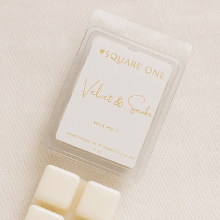 Velvet & Smoke Wax Melt in a clear clamshell package with off-white cubes, reflecting Love Square One's luxury fragrance ethos with non-toxic, handcrafted coconut soy wax.