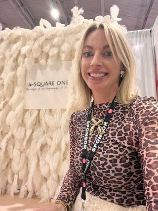 Joanna Pompano, founder of Love Square One, smiling outdoors. A personal essay about survival, mental health, and gratitude.