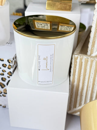 Close-up of a product packaging with a gold lid and leopard print design on a white background.