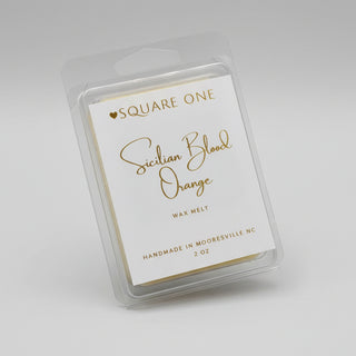 Small rectangular product with 'Square One' branding on a fluffy white surface