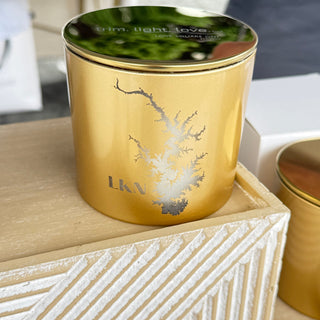 gold candle with lake norman etched in the side of it