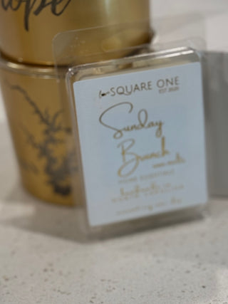 Gold container with a clear label featuring 'Square One' branding on a light background