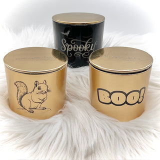 Three decorative jars with lids featuring a squirrel illustration, 'Spooky' text, and 'BOO!' text on a white fur background.
