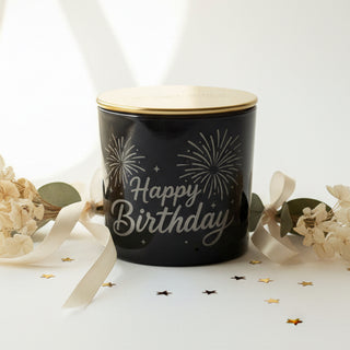 Happy birthday black candle on wood table