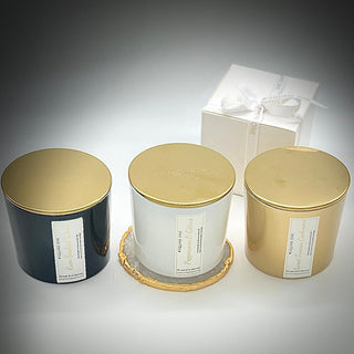 Peppercorn & Citrus candle on a coffee table surrounded by other candles